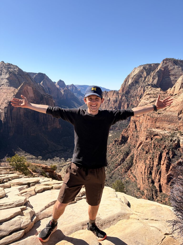 A picture of Judah Owens standing on top of Angels Landing